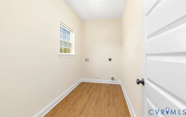 a view of a room with wooden floor and small space