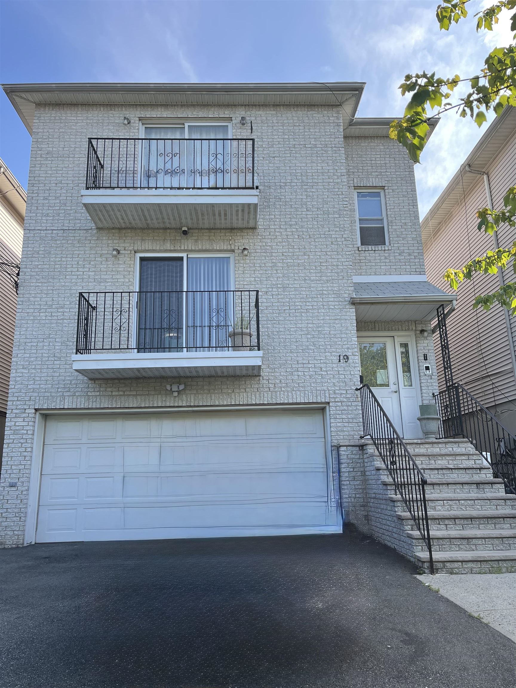 a view of front door of house with stairs