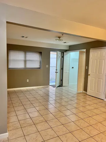 a view of an empty room and window