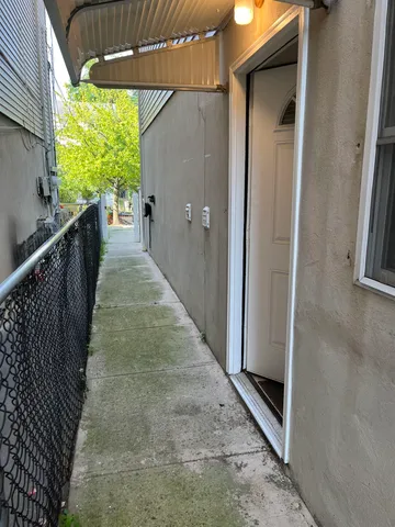 a view of a pathway of a house with wooden floor