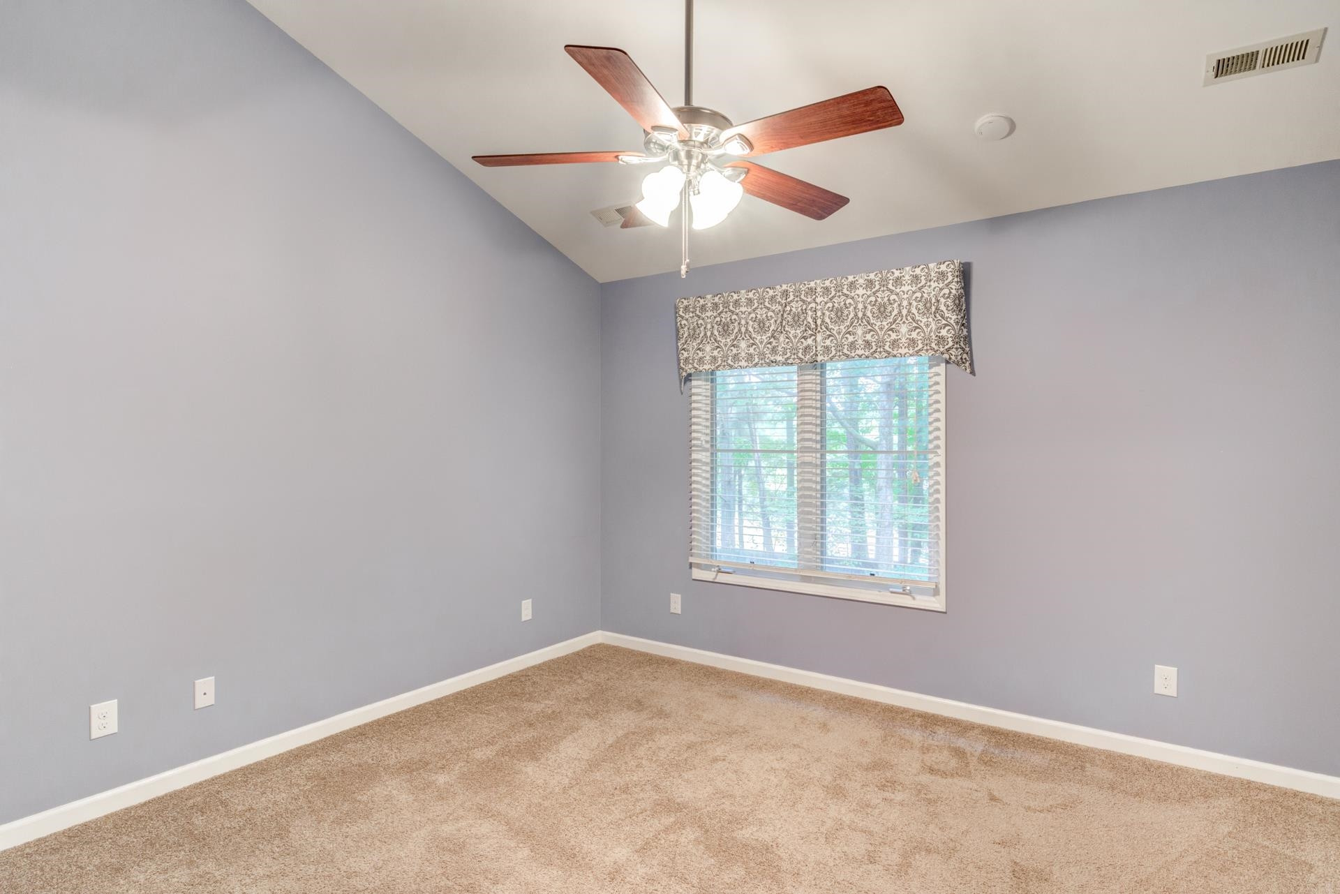 4205 Sunscape Lane Raleigh, NC 27613 - Photo 16 of 23 Vaulted ceiling. Two closets. En suite full bath. Ceiling Fan. Perfect get away after a long day. Owner's Suite