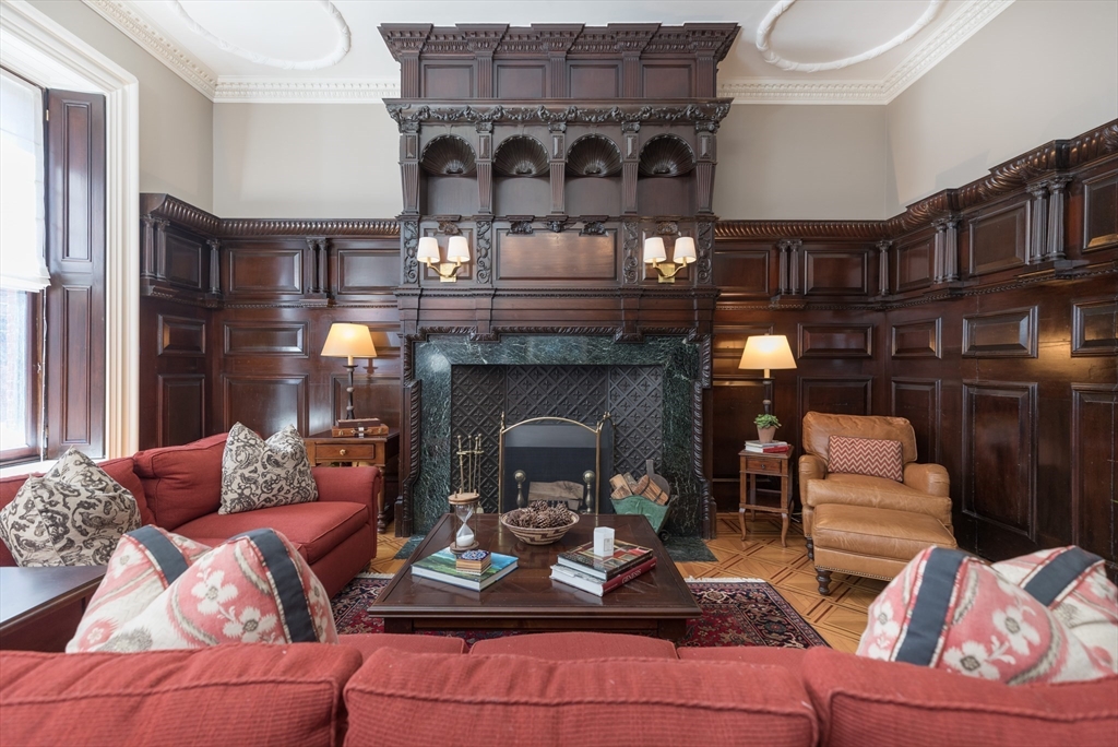 129 Beacon Street, Unit 1 Boston, MA 02116 - Photo 1 of 42 a living room with furniture and a fireplace