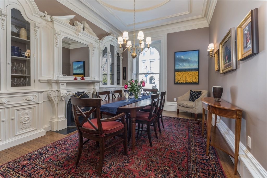 129 Beacon Street, Unit 1 Boston, MA 02116 - Photo 12 of 42 a view of a dining room with furniture and a chandelier