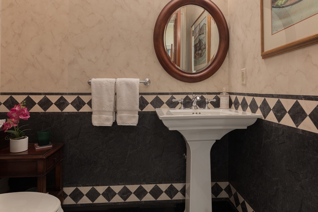 129 Beacon Street, Unit 1 Boston, MA 02116 - Photo 16 of 42 a bathroom with a sink and a mirror