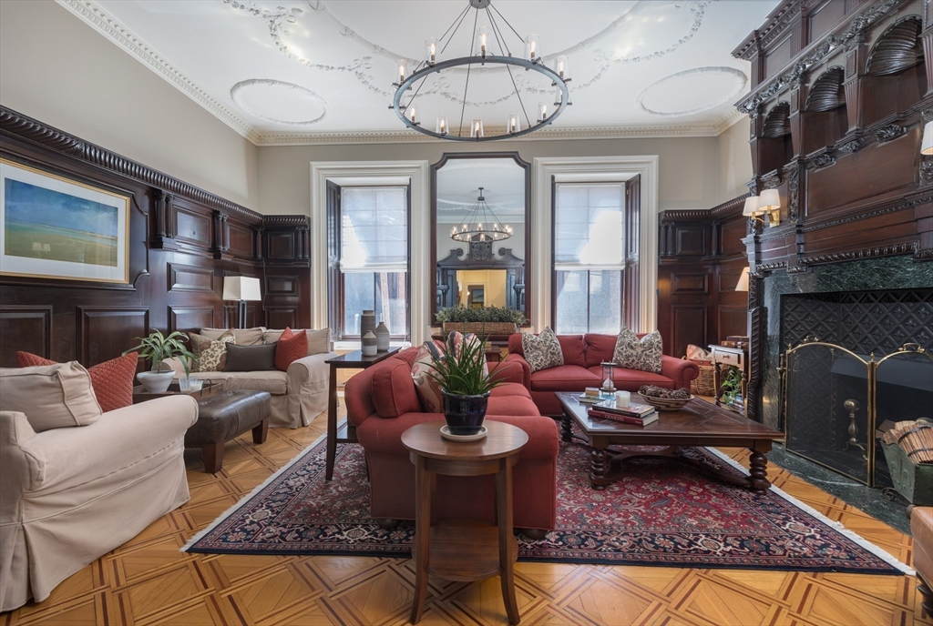 129 Beacon Street, Unit 1 Boston, MA 02116 - Photo 2 of 42 a living room with furniture fireplace and a chandelier