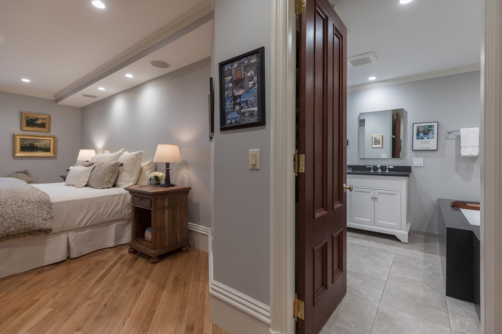 129 Beacon Street, Unit 1 Boston, MA 02116 - Photo 23 of 42 a bedroom with a bed and a view of bathroom