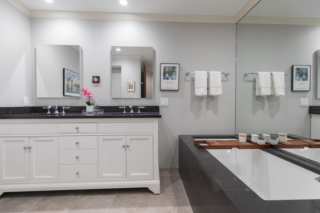 129 Beacon Street, Unit 1 Boston, MA 02116 - Photo 24 of 42 a bathroom with a sink and a mirror