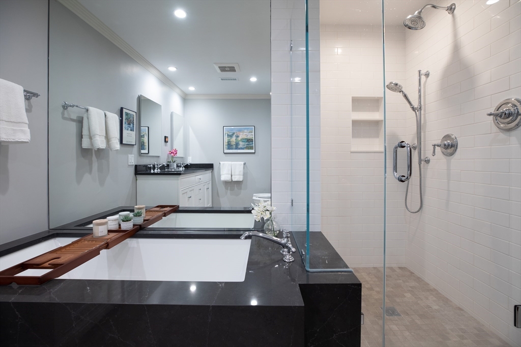 129 Beacon Street, Unit 1 Boston, MA 02116 - Photo 27 of 42 a room with gym equipment and a shower