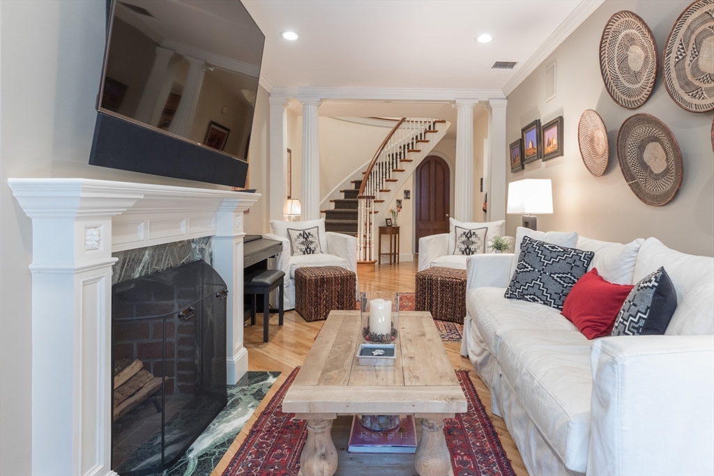 129 Beacon Street, Unit 1 Boston, MA 02116 - Photo 30 of 42 a living room with furniture and a fireplace