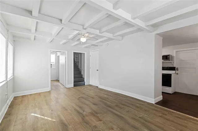a kitchen with stainless steel appliances a stove a sink and cabinets