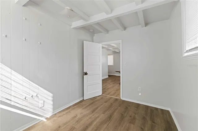 a bedroom with a bed and a lamp