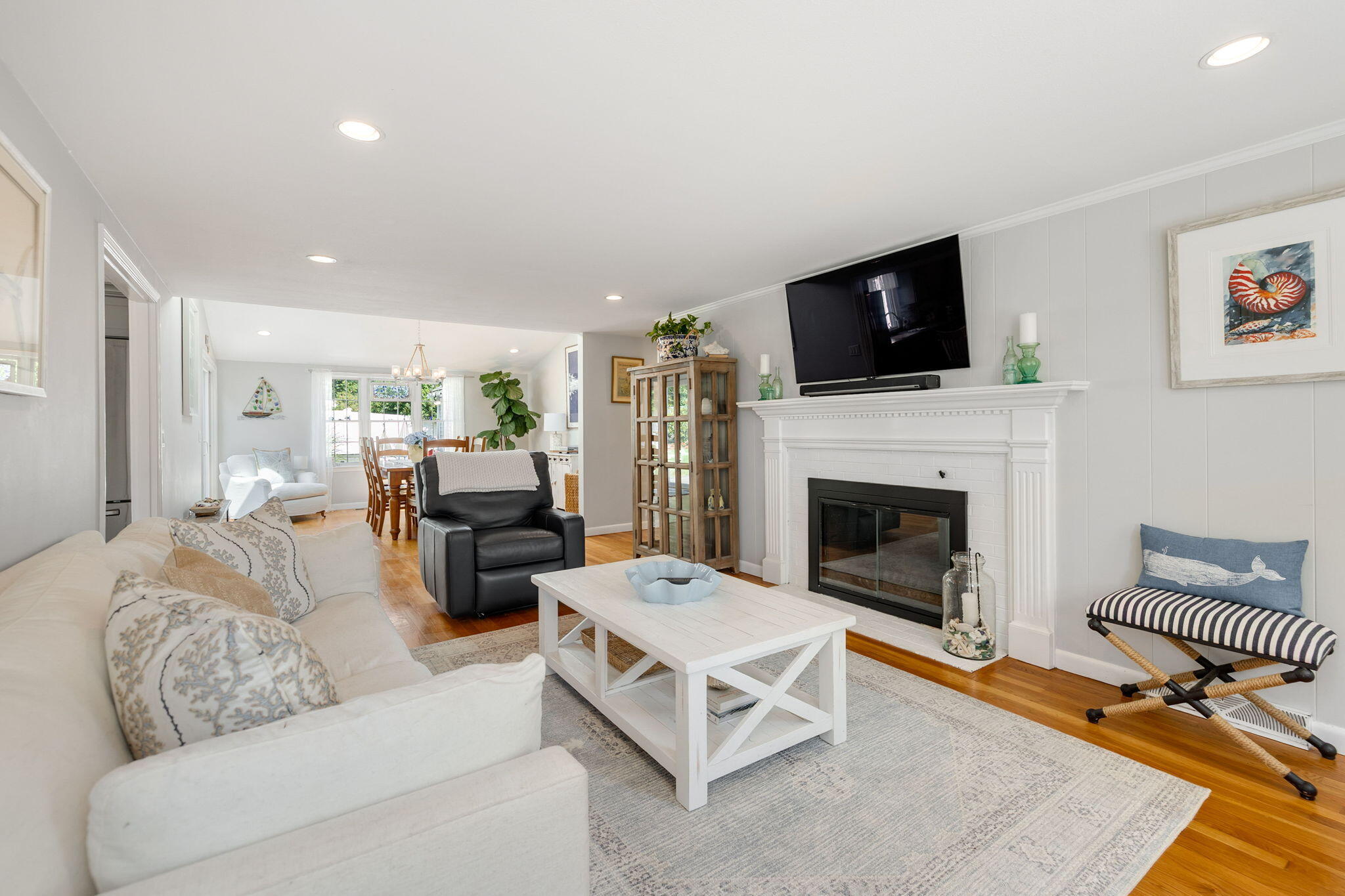 26 Captain Chase Road South Yarmouth, MA 02664 - Photo 14 of 54 a living room with furniture a flat screen tv and a fireplace