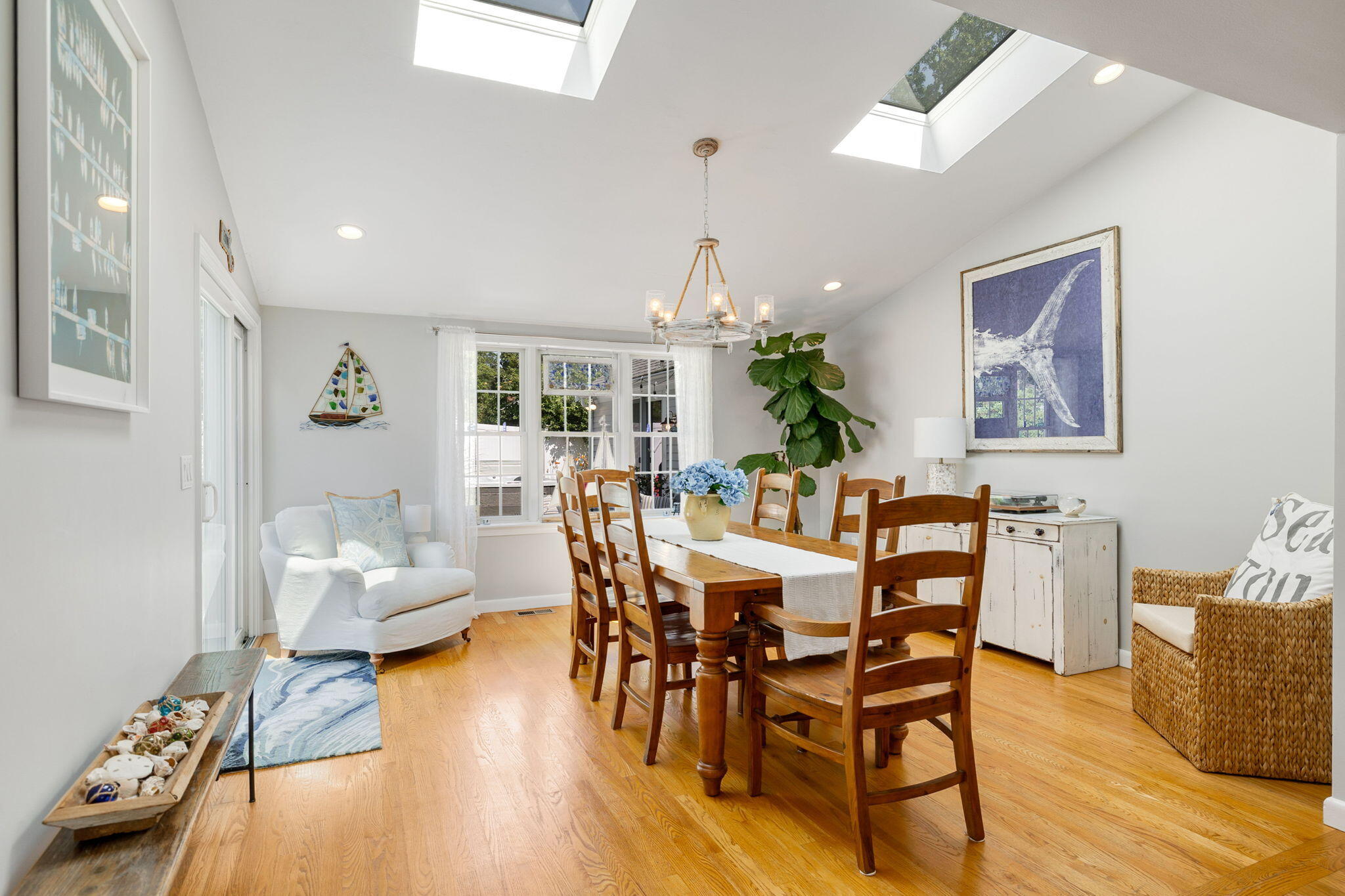 26 Captain Chase Road South Yarmouth, MA 02664 - Photo 19 of 54 a view of a dining room with furniture wooden floor and chandelier
