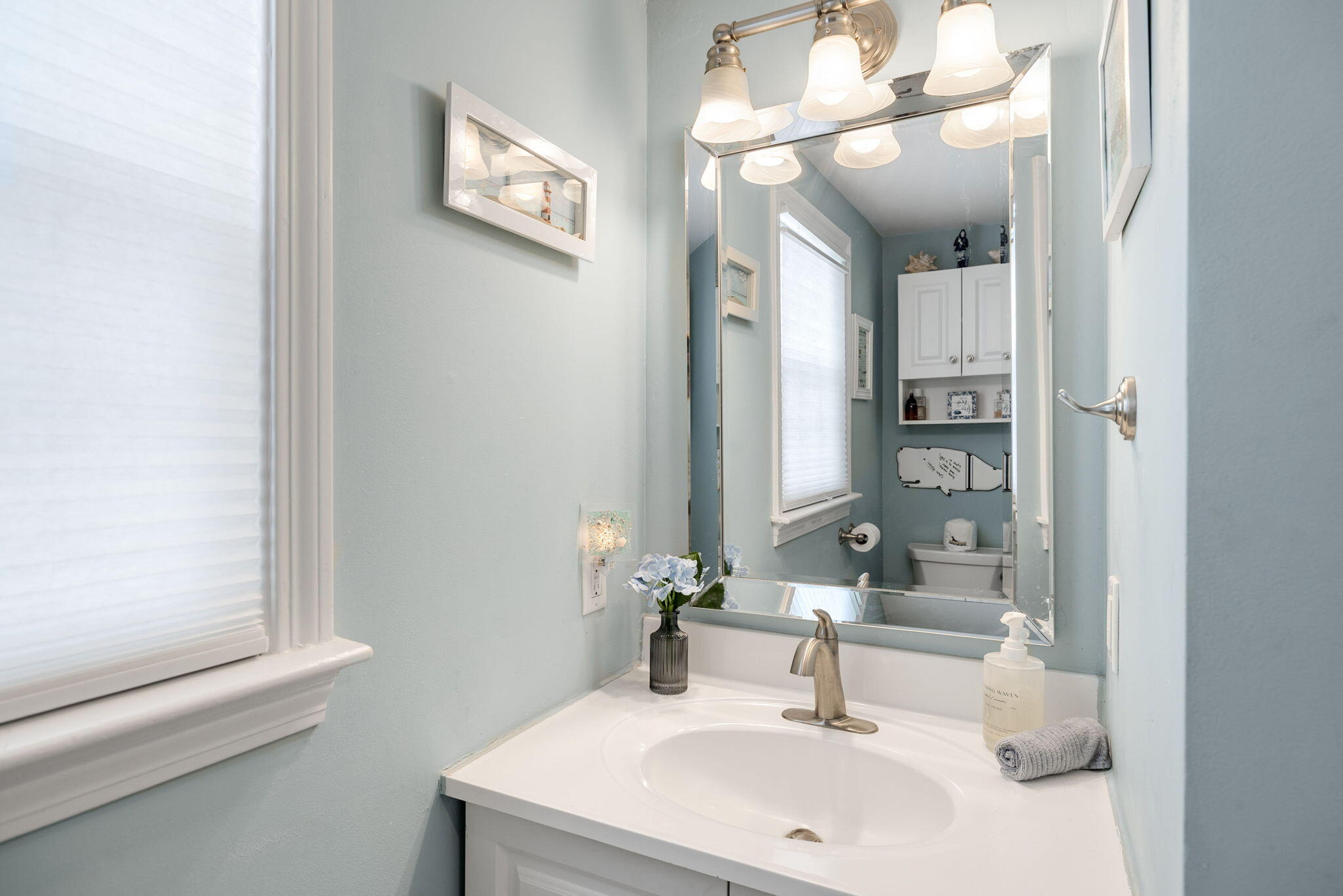 26 Captain Chase Road South Yarmouth, MA 02664 - Photo 32 of 54 a bathroom with a sink and a mirror