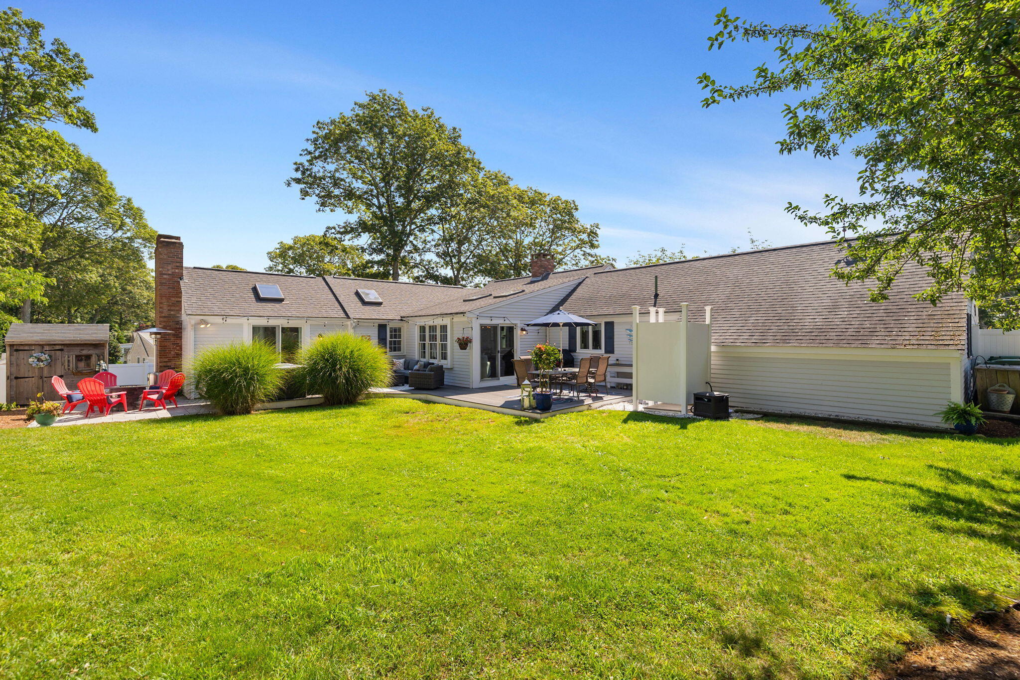 26 Captain Chase Road South Yarmouth, MA 02664 - Photo 35 of 54 a front view of a house with patio and garden