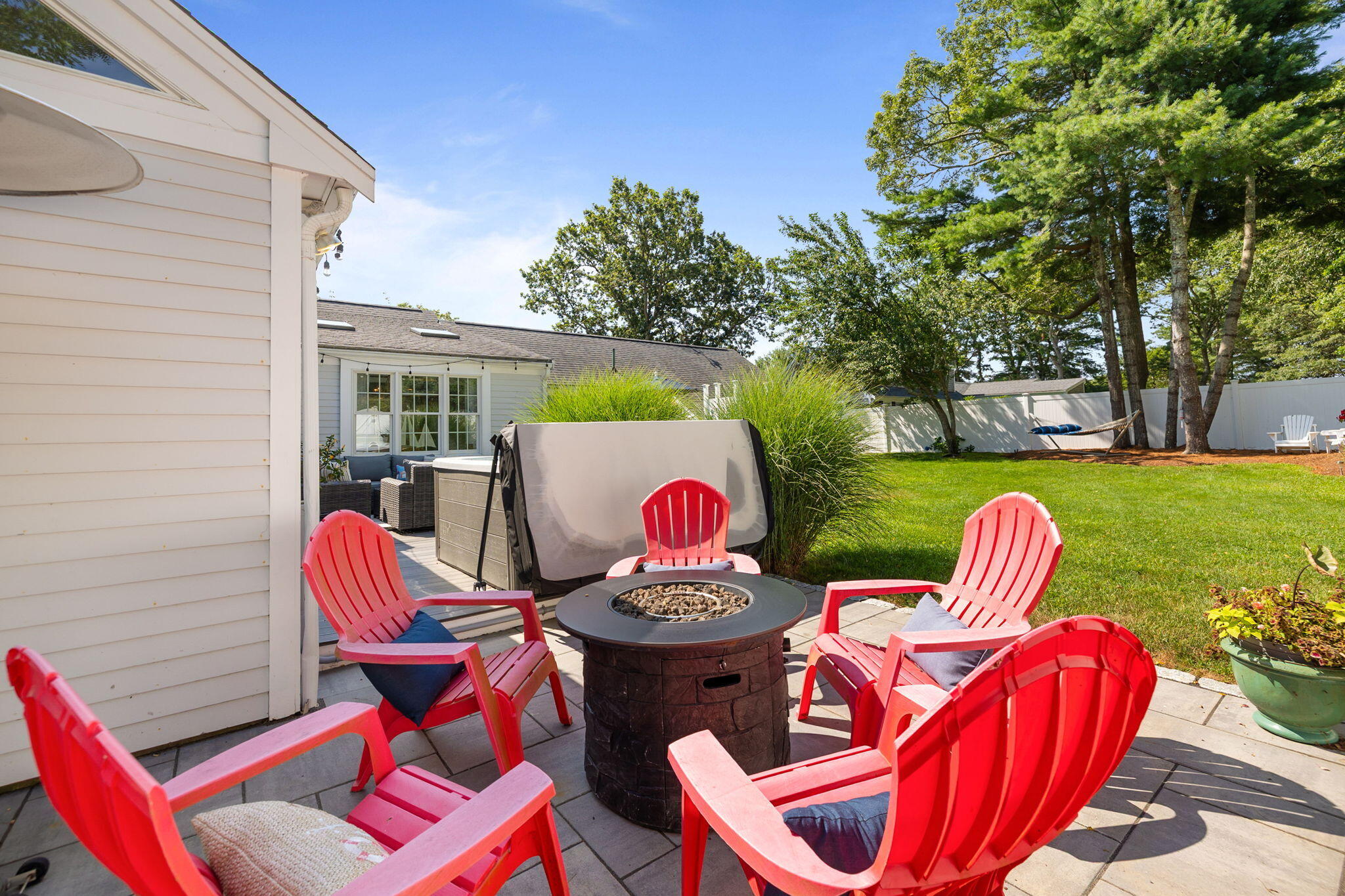 26 Captain Chase Road South Yarmouth, MA 02664 - Photo 40 of 54 a table and chairs with the outdoor seating
