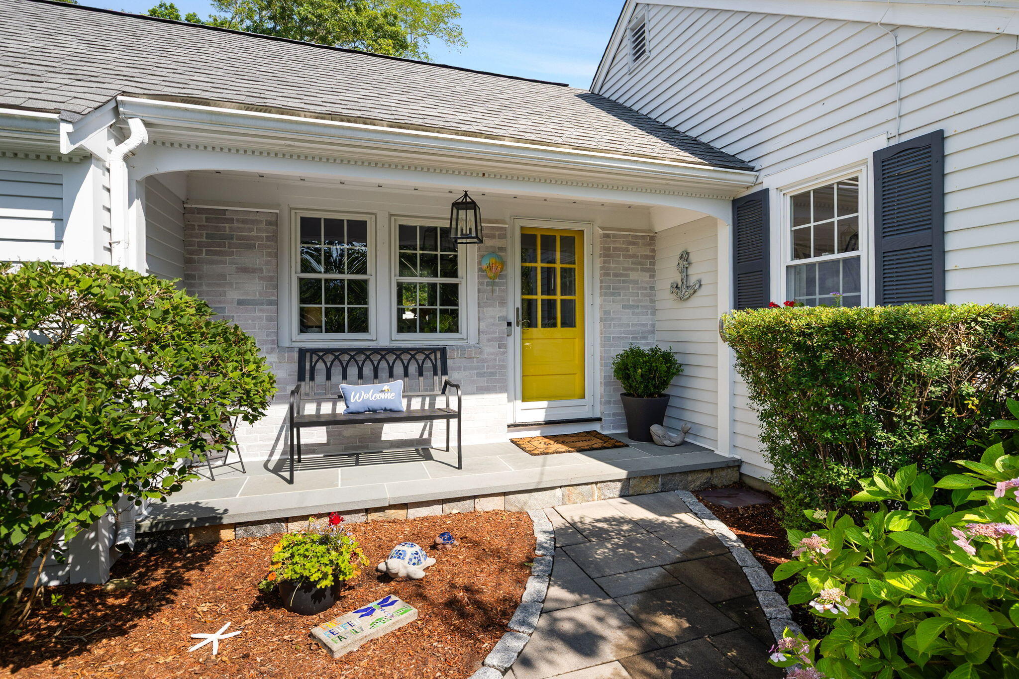 26 Captain Chase Road South Yarmouth, MA 02664 - Photo 5 of 54 a front view of a house with outdoor seating