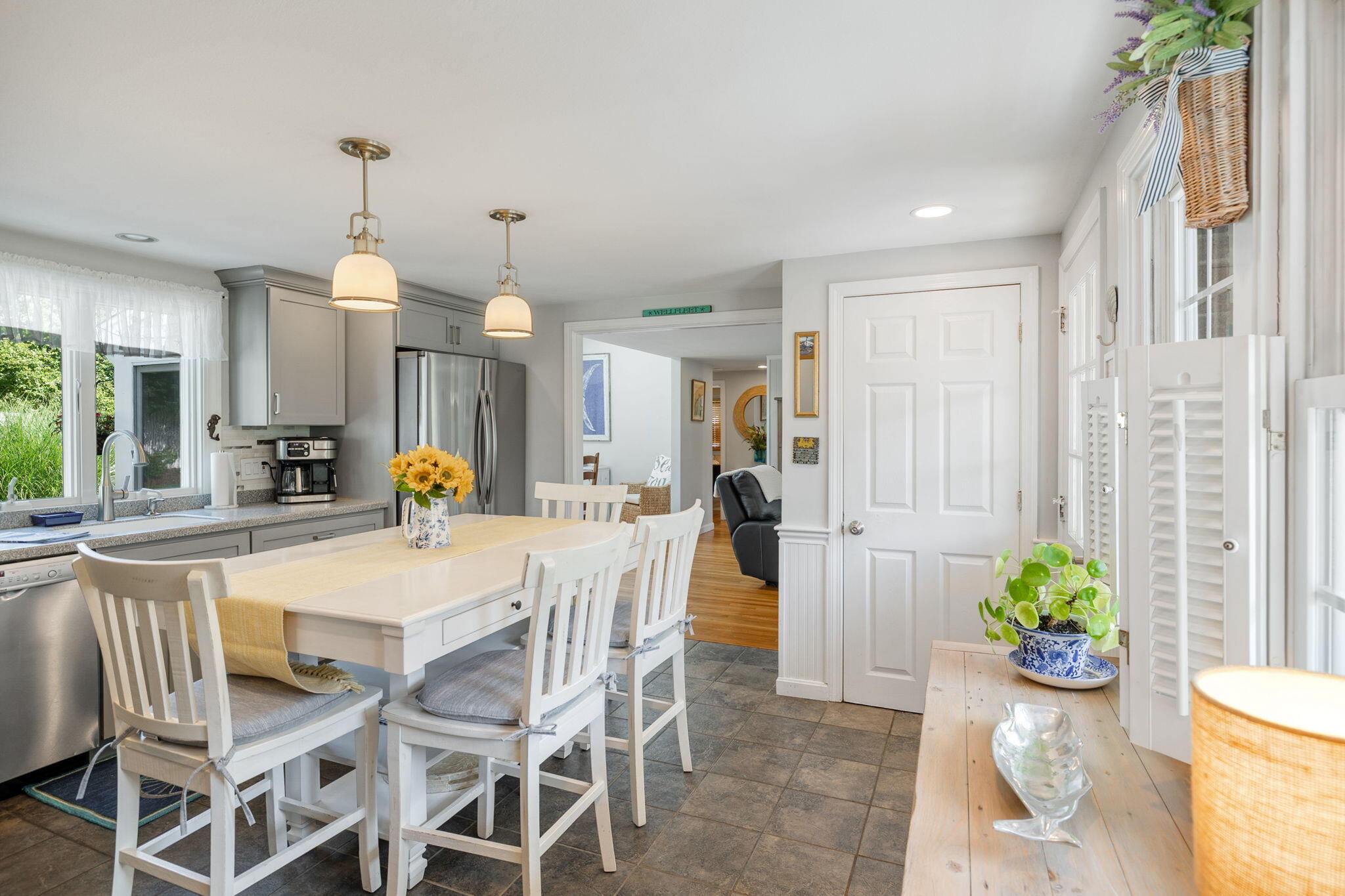 26 Captain Chase Road South Yarmouth, MA 02664 - Photo 7 of 54 a view of a dining room with furniture and a potted plant