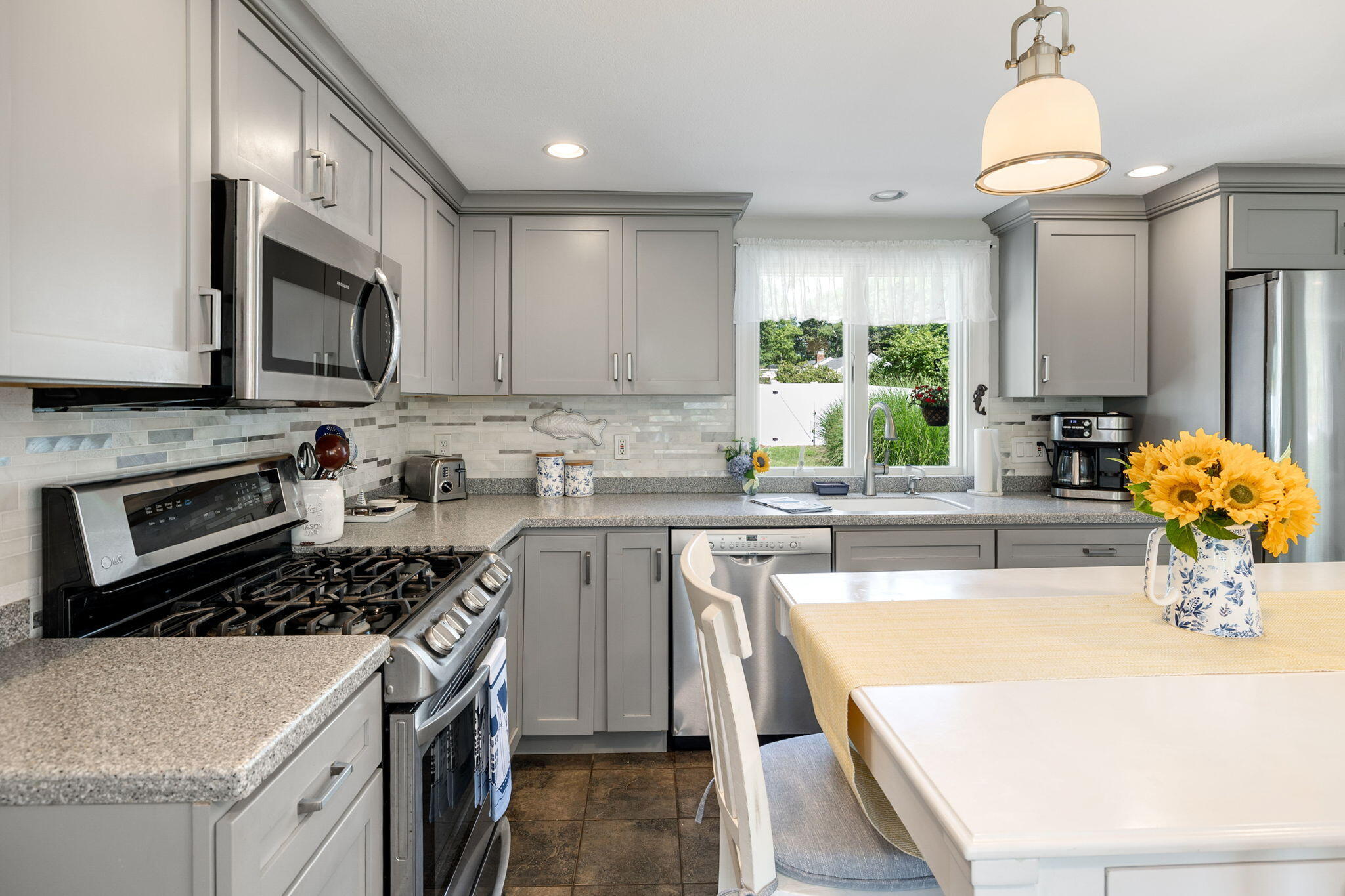 26 Captain Chase Road South Yarmouth, MA 02664 - Photo 8 of 54 a kitchen with stainless steel appliances a stove sink microwave and cabinets