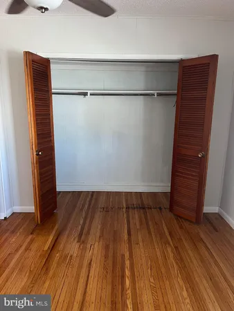 a view of wooden floor with staircase