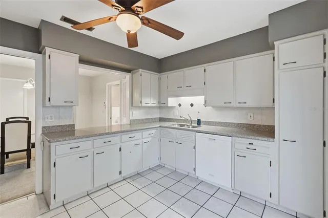 a kitchen with sink and window