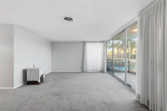 a view of an empty room with windows