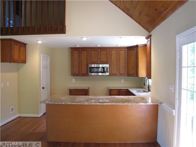 1040 New Moon Road Germanton, NC 27019 - Photo 2 of 16 Kitchen. All new kitchen w/pantry, new cabinets, granite counters, DW & microwave.