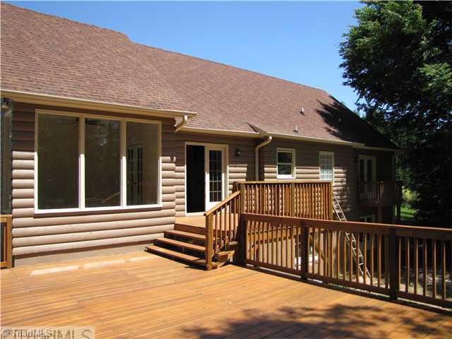 1040 New Moon Road Germanton, NC 27019 - Photo 13 of 16 Exterior Back. Den overlooking deck. Very large Brand New Deck!