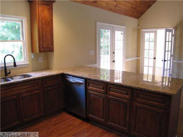 1040 New Moon Road Germanton, NC 27019 - Photo 3 of 16 Kitchen. Kitchen is very bright. Beautiful ceilings. Opens to Living Room.