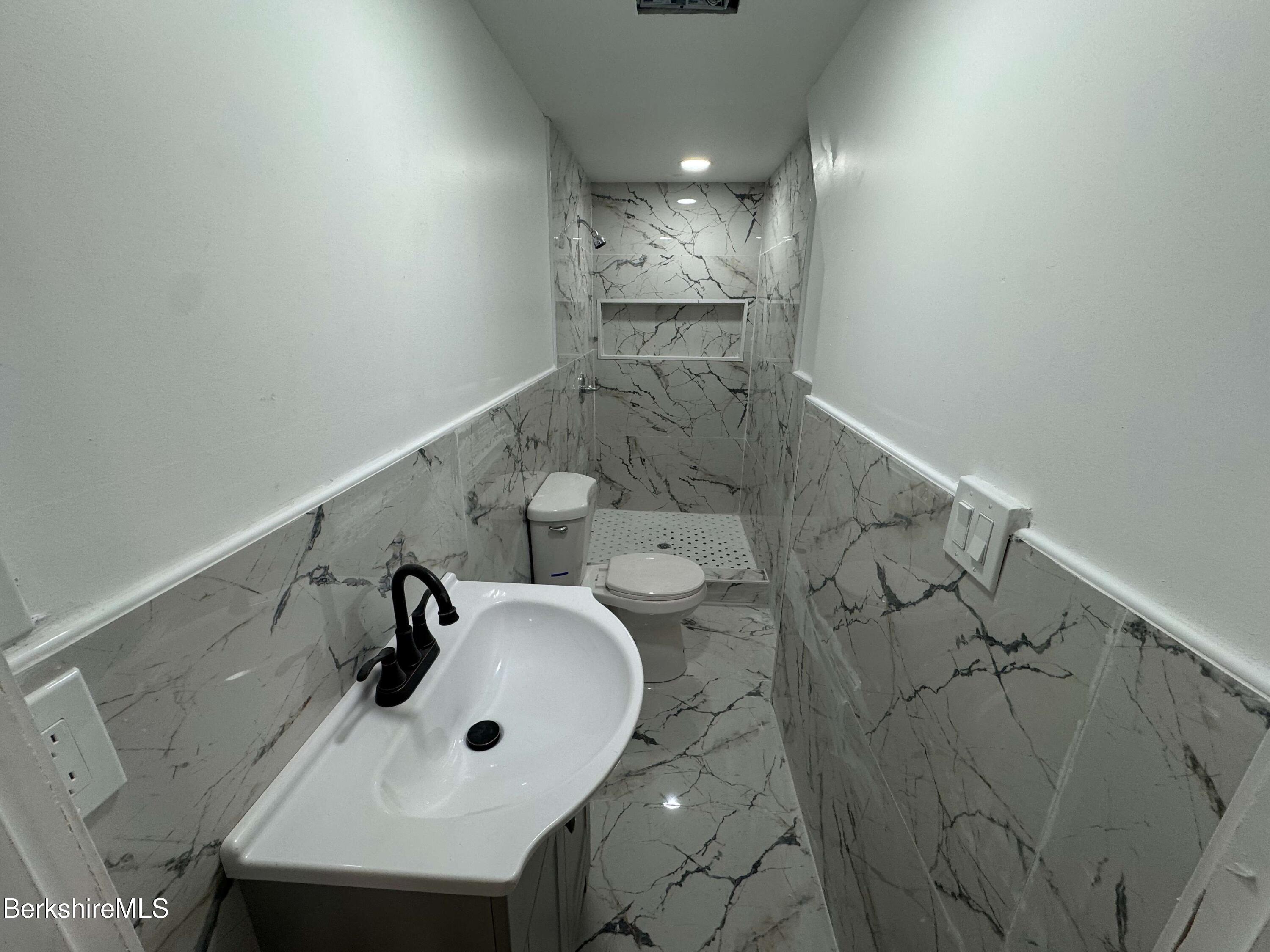 16 North Summer Street, Unit 6 Adams, MA 01220 - Photo 7 of 7 a bathroom with a sink and mirror