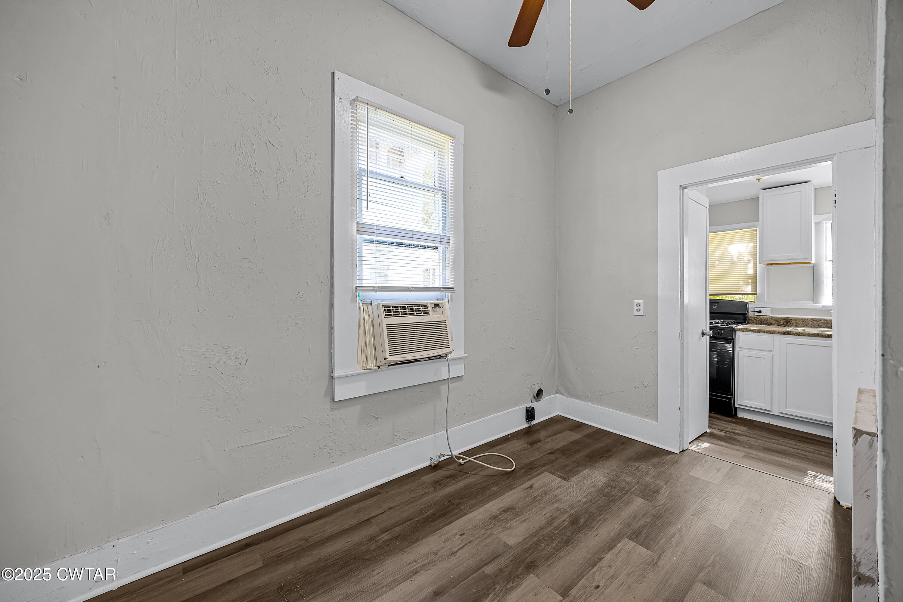 220 Division Avenue Jackson, TN 38301 - Photo 11 of 15 wooden floor in an empty room with a window