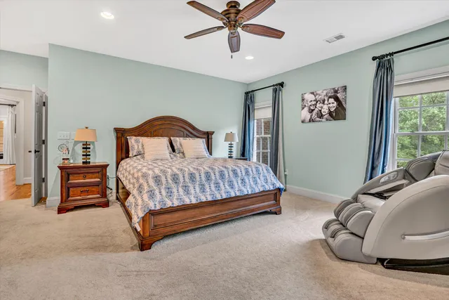 a room that has painting on the wall and a rug