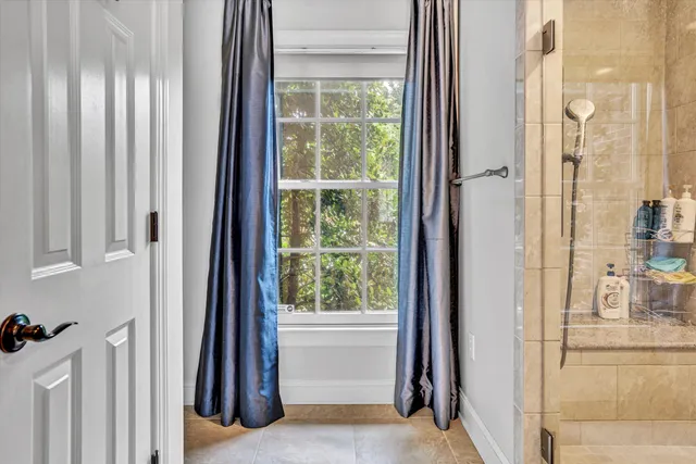 a kitchen with a sink cabinets and a window