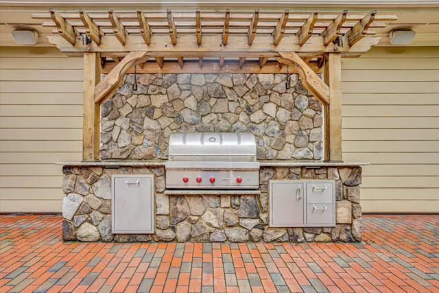 a aerial view of a house with a big yard and potted plants
