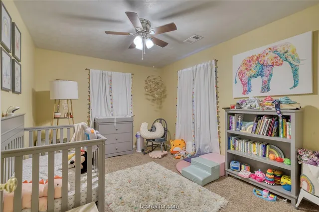 a view of a livingroom with furniture and toys