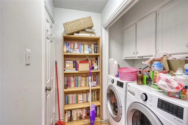 a storage room with washer and dryer