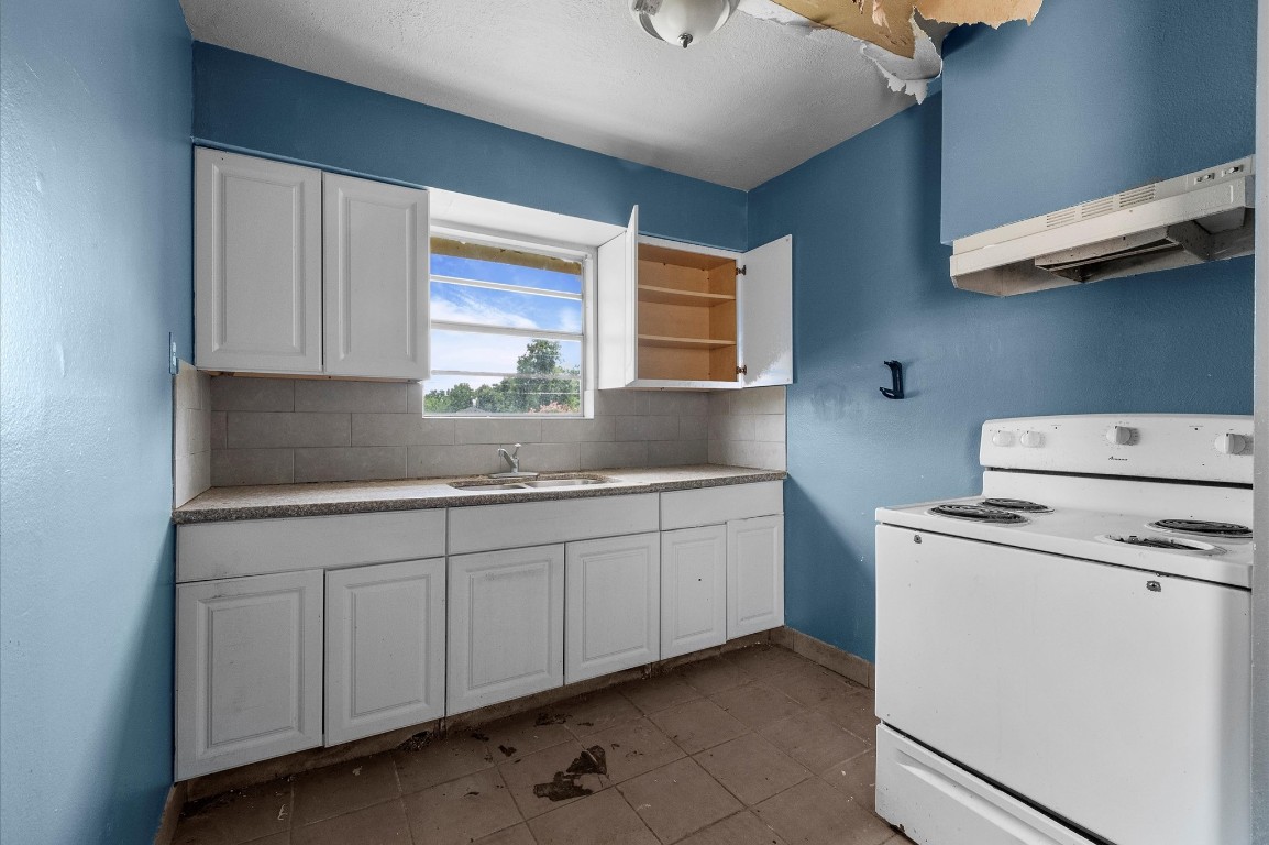 14504 Corpus Christi Street, Unit 4 Houston, TX 77015 - Photo 21 of 33 a kitchen with sink cabinets and window