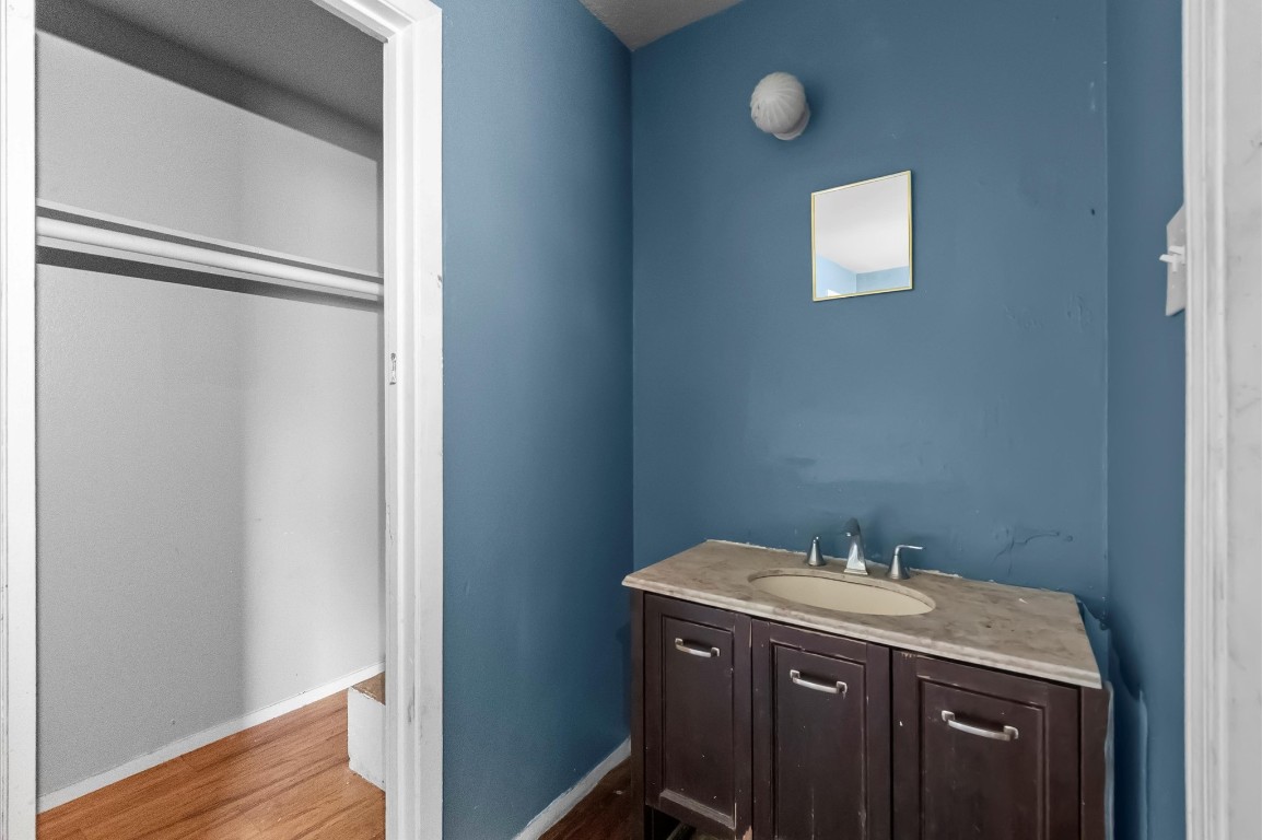 14504 Corpus Christi Street, Unit 4 Houston, TX 77015 - Photo 23 of 33 a bathroom with a granite countertop sink and a mirror