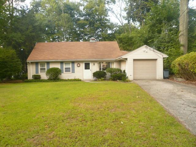 2 Saddle Road Norwalk, CT 06851 - Photo 1 of 1 a white house that has a tree in front of it