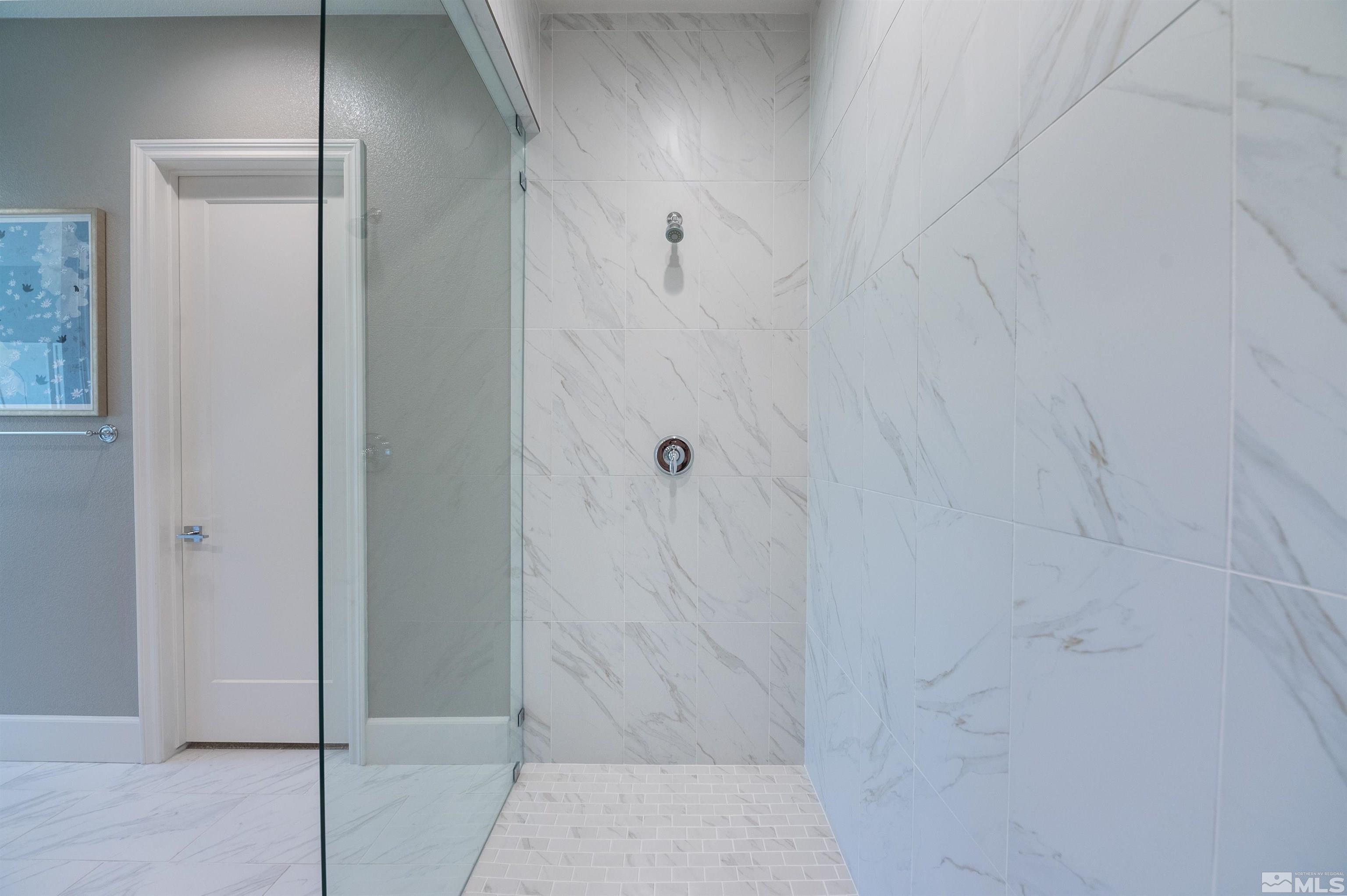 12519 Blue Stream Street, Unit HOMESITE 138 Reno, NV 89521 - Photo 5 of 9 a bathroom with a shower
