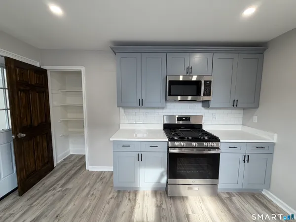 a view of entryway with wooden floor