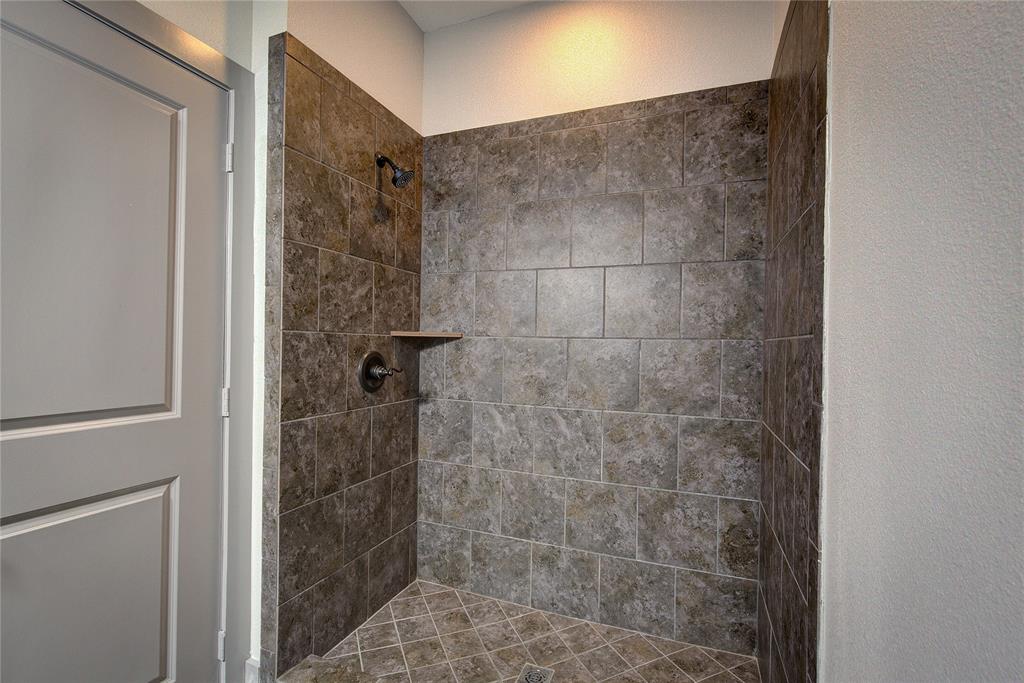 600 Maple Street Commerce, TX 75428 - Photo 22 of 35 a bathroom with a shower