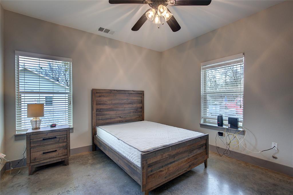 600 Maple Street Commerce, TX 75428 - Photo 24 of 35 a bedroom with a bed and window