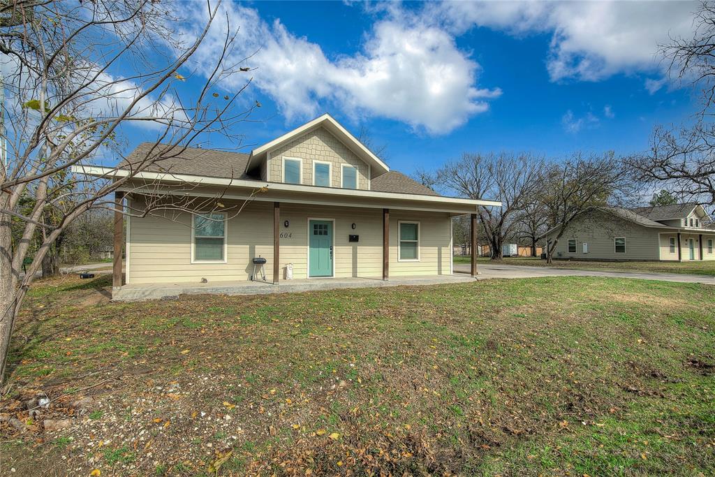 600 Maple Street Commerce, TX 75428 - Photo 33 of 35 a front view of a house with garden