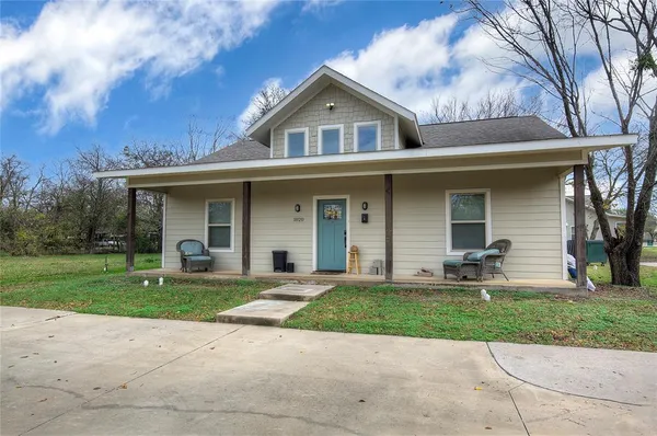 front view of a house with a yard