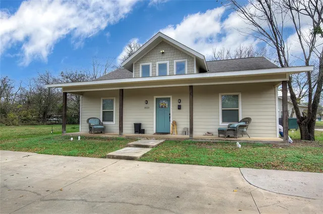 front view of a house with a yard