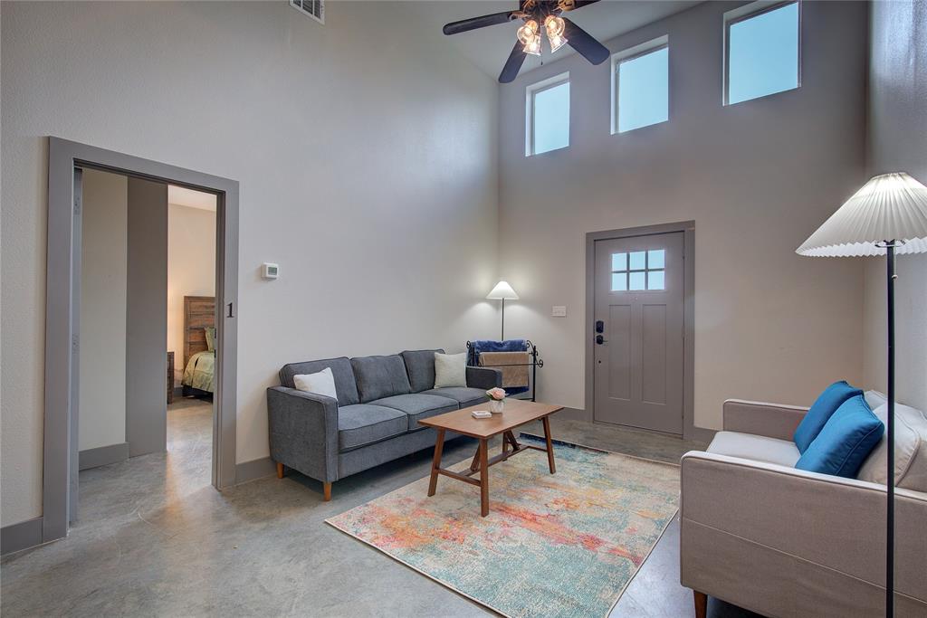 600 Maple Street Commerce, TX 75428 - Photo 5 of 35 a living room with furniture and a lamp