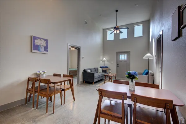 a dining room with furniture and window