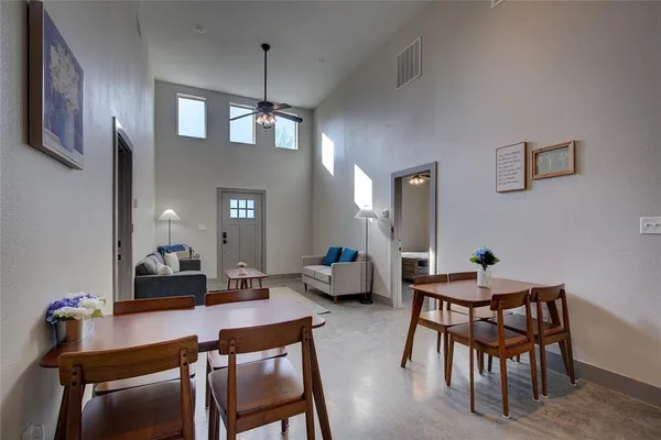 a dining room with furniture and window