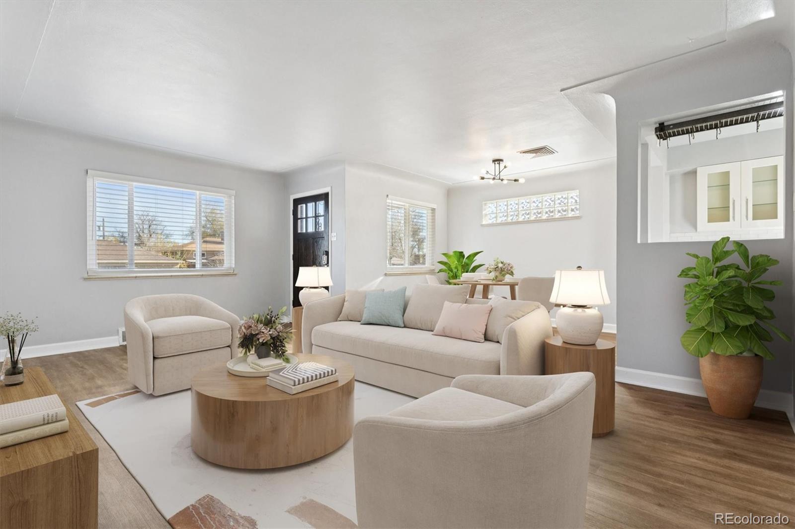 81 South Ingalls Street Lakewood, CO 80226 - Photo 1 of 29 a living room with furniture and a potted plant